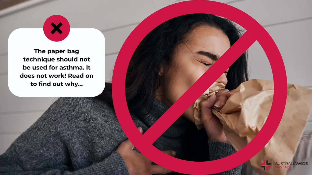 Woman breathing into a paper bag, with a red cross overlaid to indicate not to do this